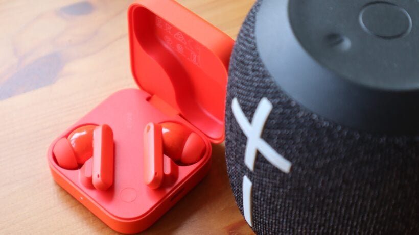 The CMF Buds 2 stood next to the Ultimate Earbuds Wonderboom 2 speaker