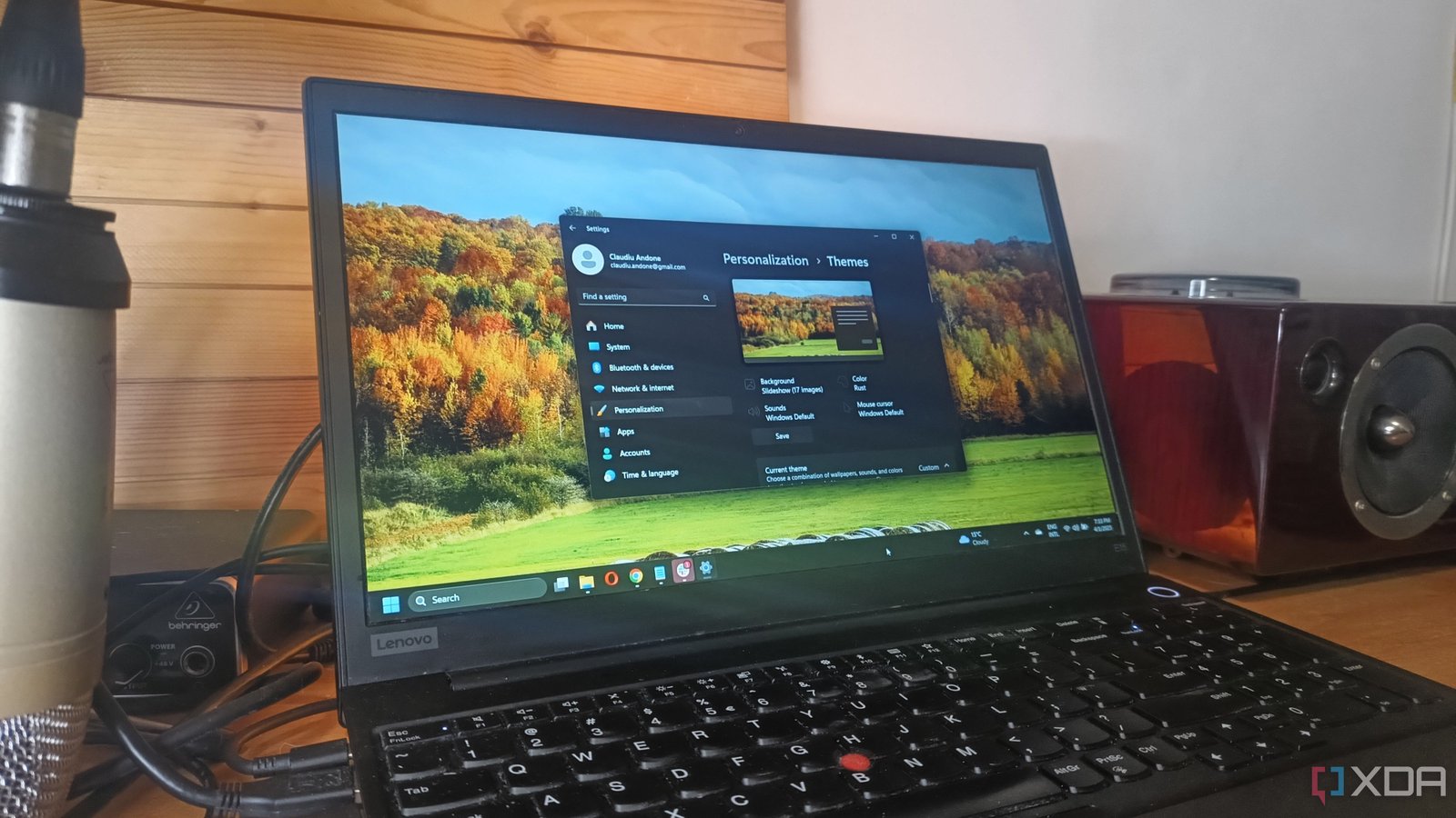 Windows 11 laptop screen displaying the theme personalization window